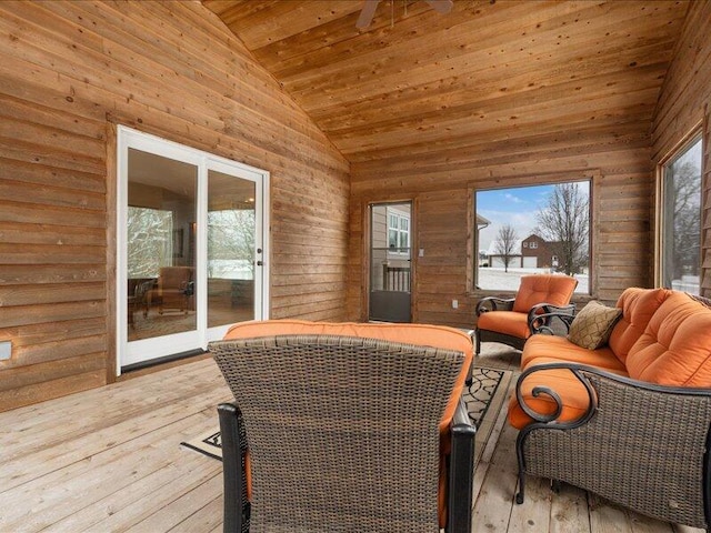 sunroom / solarium featuring wooden ceiling and vaulted ceiling