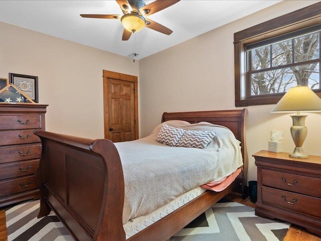 bedroom with light wood-style floors and ceiling fan