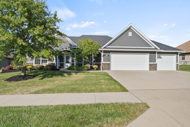 craftsman house with a garage, driveway, and a front yard