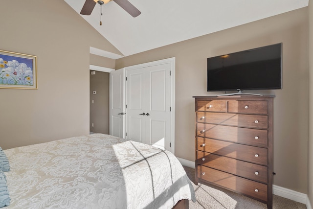 bedroom with baseboards, a ceiling fan, vaulted ceiling, carpet floors, and a closet