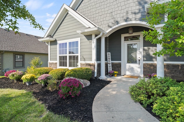 entrance to property with stone siding