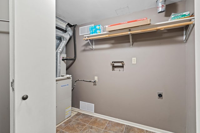 washroom featuring laundry area, baseboards, visible vents, washer hookup, and electric dryer hookup