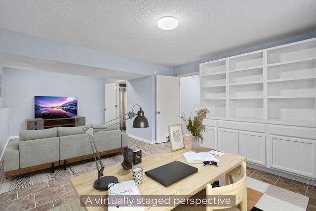 office area featuring a textured ceiling