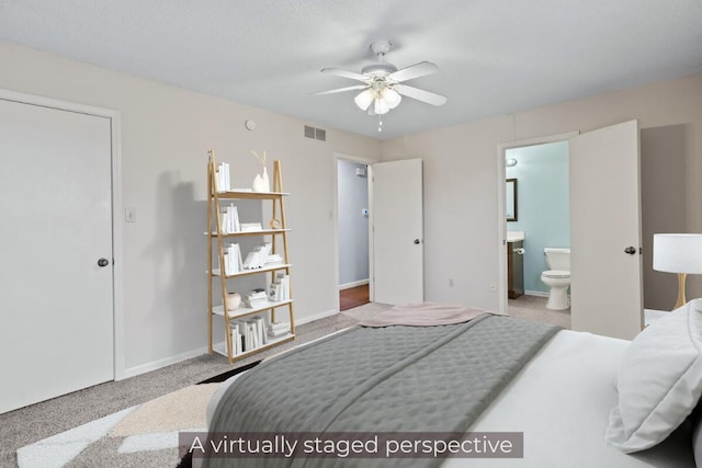 bedroom featuring ensuite bath, carpet, visible vents, and baseboards