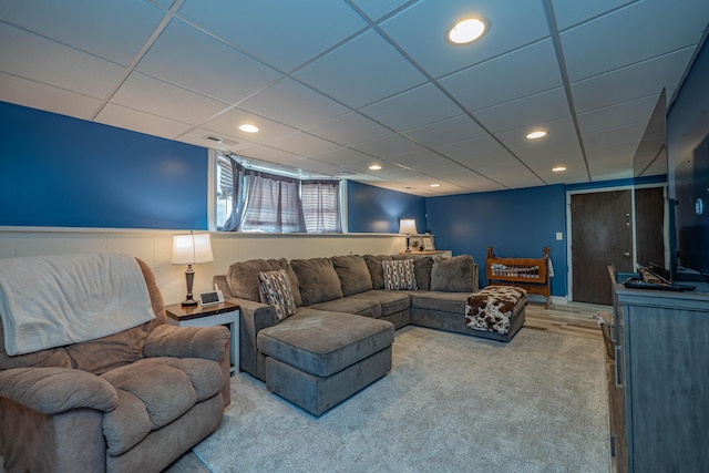 living room featuring recessed lighting, visible vents, a paneled ceiling, and a wainscoted wall