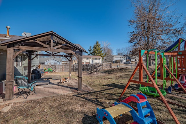 view of playground featuring a gazebo, a patio, and a fenced backyard