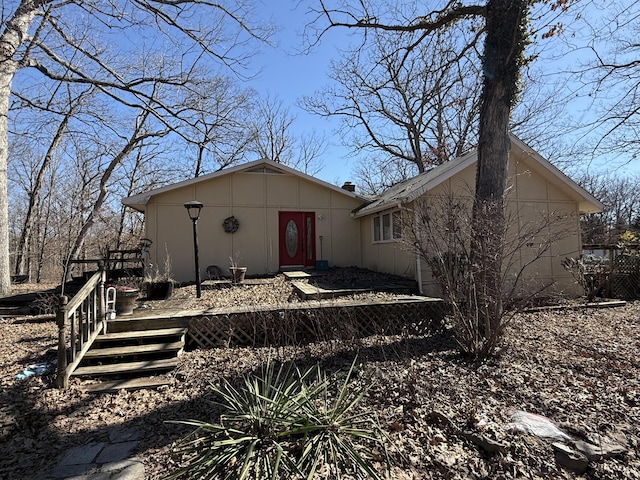 exterior space featuring a wooden deck