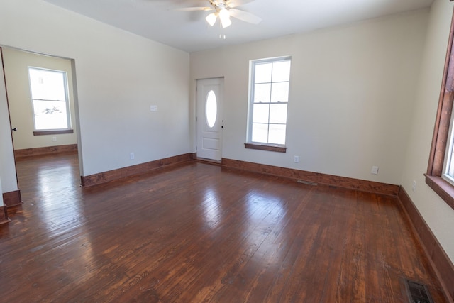 entryway featuring visible vents, dark wood finished floors, and a wealth of natural light