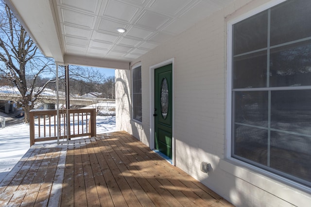 view of snow covered deck