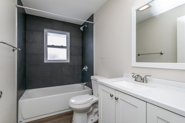 full bathroom with shower / washtub combination, vanity, toilet, and wood finished floors