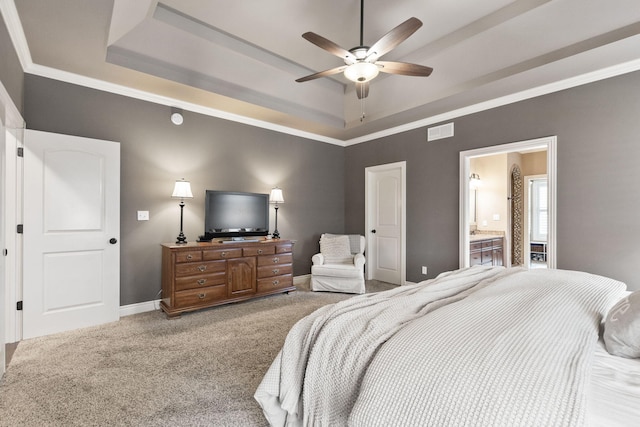 bedroom featuring baseboards, a raised ceiling, visible vents, and light colored carpet