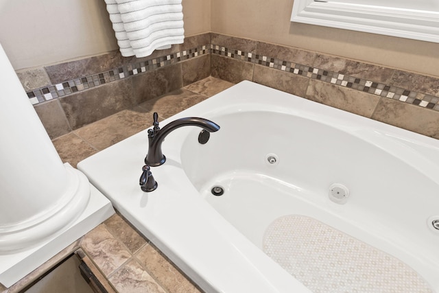 full bathroom with a whirlpool tub