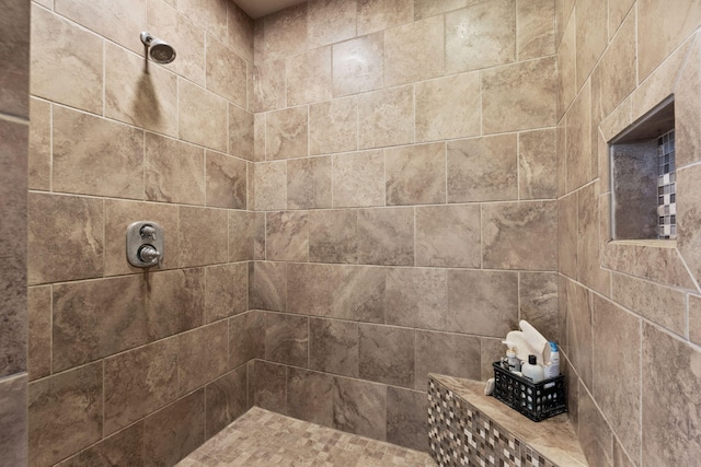 full bathroom with tiled shower