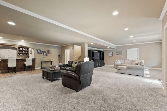 carpeted living room featuring baseboards, ornamental molding, bar area, and recessed lighting