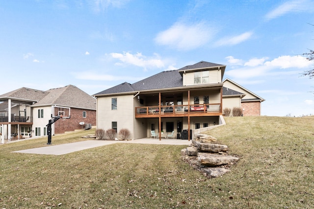 back of property with a patio area and a lawn