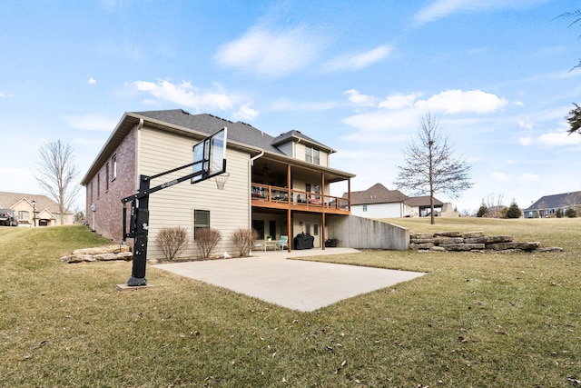 back of house featuring a patio and a lawn