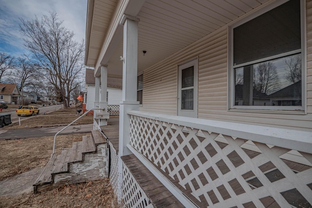 view of side of home with a porch