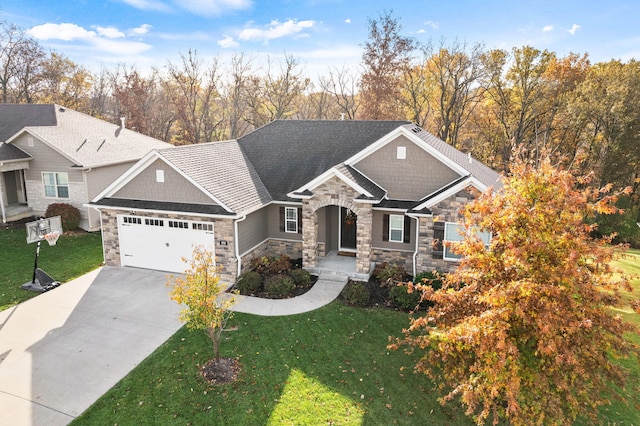 craftsman-style home with an attached garage, a front lawn, and concrete driveway