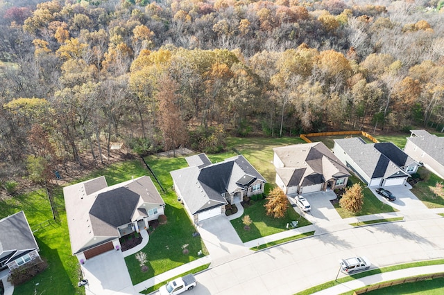 bird's eye view with a residential view and a wooded view