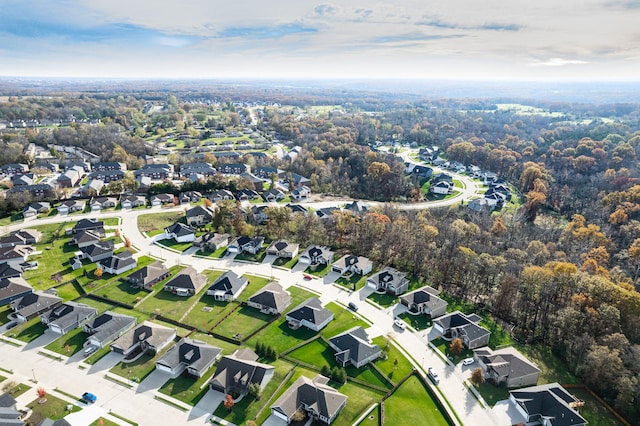 birds eye view of property with a residential view