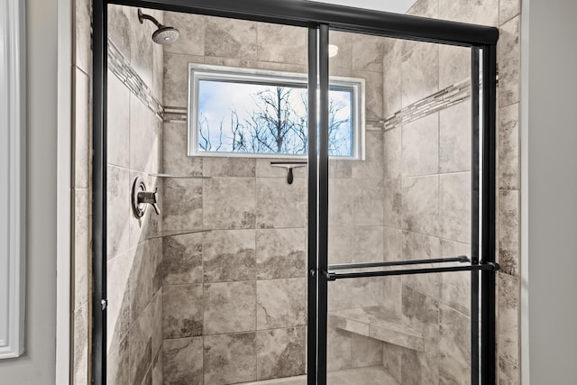 full bathroom featuring tiled shower