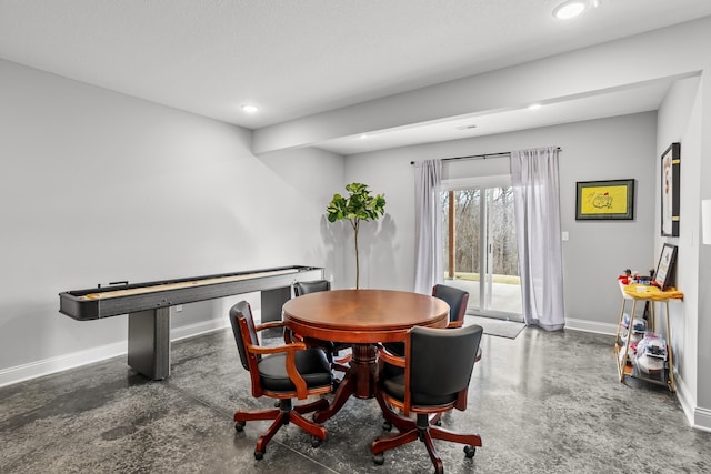 dining room with recessed lighting and baseboards