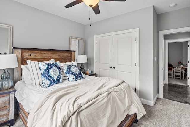 bedroom with ceiling fan, a closet, carpet, and baseboards