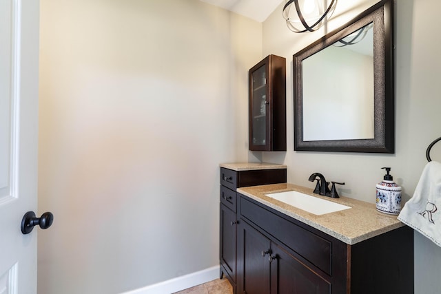 bathroom featuring baseboards and vanity