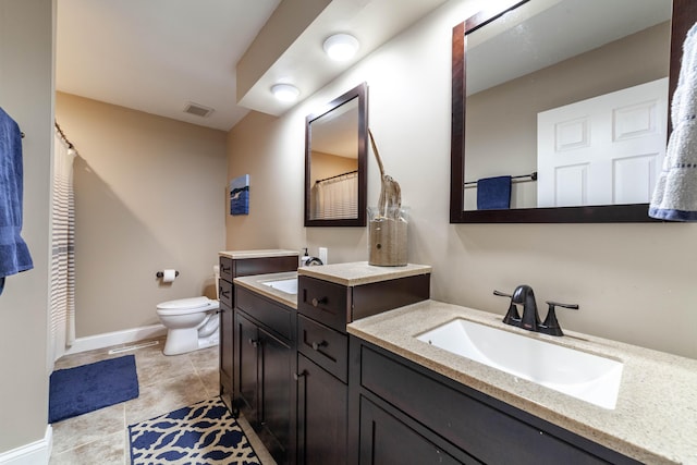 full bathroom with visible vents, a sink, toilet, and baseboards