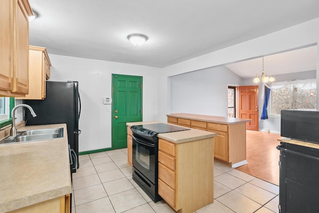 kitchen featuring light brown cabinets, a kitchen island, light countertops, and black electric range oven