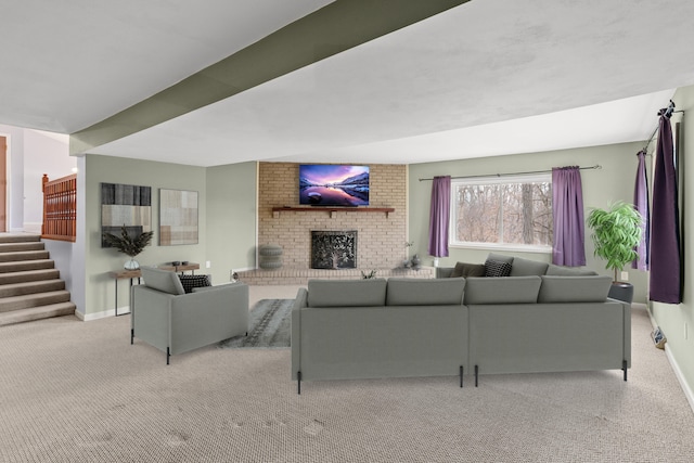 living area featuring light carpet, stairs, baseboards, and a fireplace