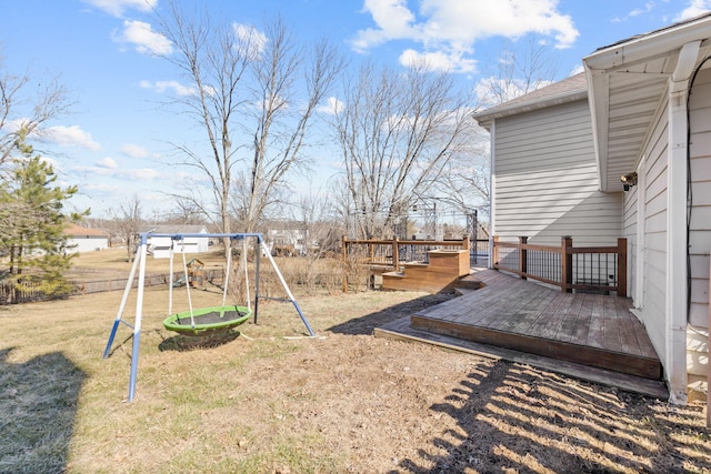 view of yard with a playground and a wooden deck