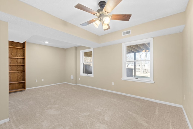 spare room featuring carpet, recessed lighting, visible vents, ceiling fan, and baseboards