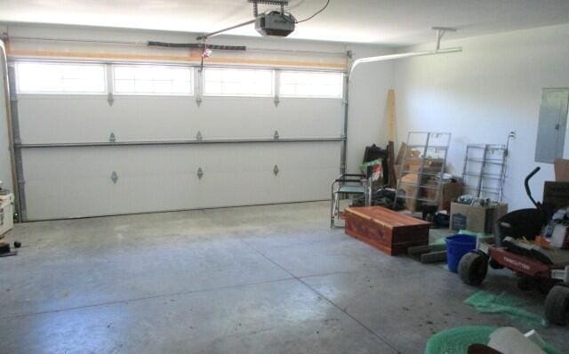 305 E Francis St, Sturgeon, MO 65284 - garage with a garage door opener