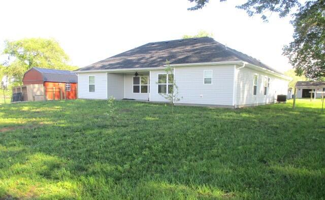 305 E Francis St, Sturgeon, MO 65284 - back of property featuring a lawn