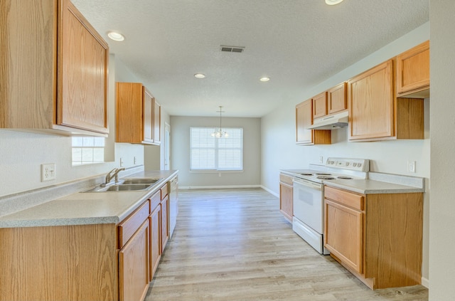 kitchen with white range with electric stovetop, visible vents, light countertops, under cabinet range hood, and pendant lighting