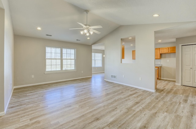 unfurnished living room with light wood-type flooring, baseboards, and visible vents