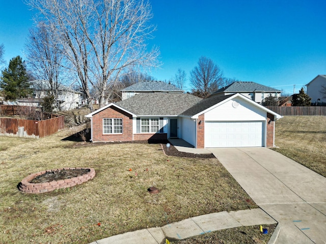 view of front of property with driveway, an attached garage, fence, a front yard, and brick siding