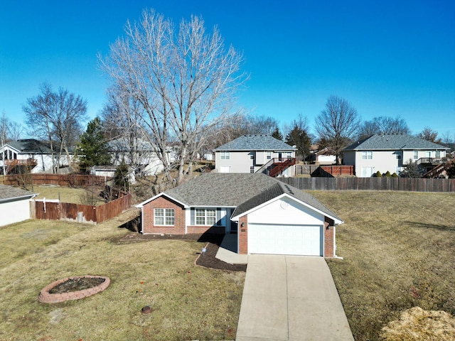 single story home with brick siding, concrete driveway, fence, a residential view, and a front lawn