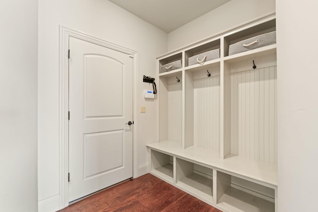 mudroom with dark wood finished floors