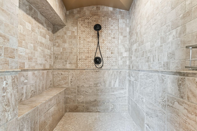 full bath with a tile shower