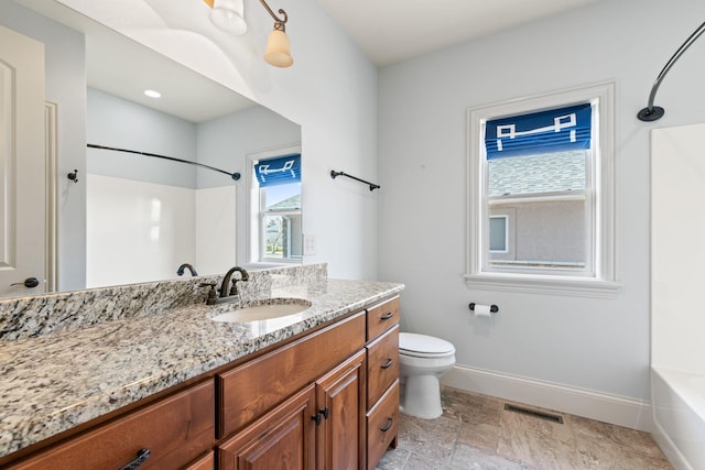 bathroom featuring visible vents, toilet, vanity, shower / tub combination, and baseboards