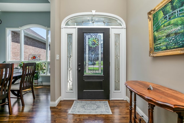 entryway featuring wood finished floors and baseboards