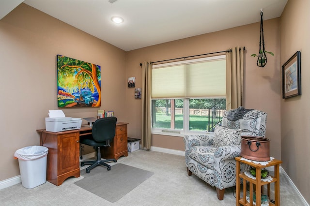 office area featuring light colored carpet and baseboards