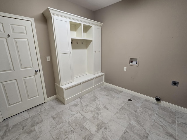 mudroom with marble finish floor and baseboards