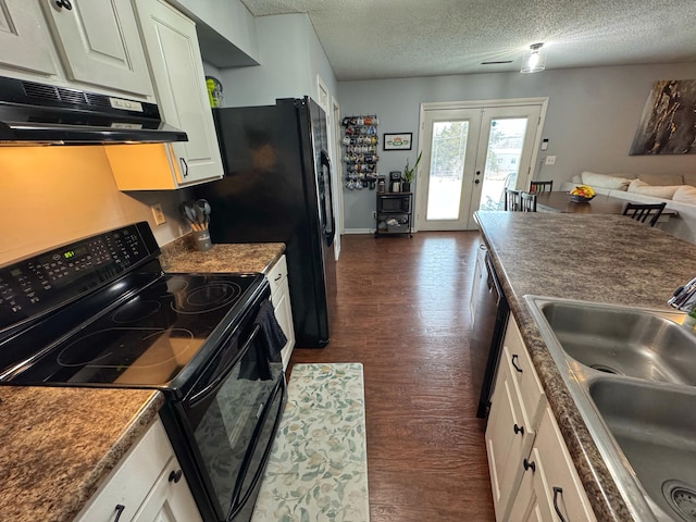 kitchen featuring black range with electric cooktop, under cabinet range hood, a sink, white cabinetry, and french doors