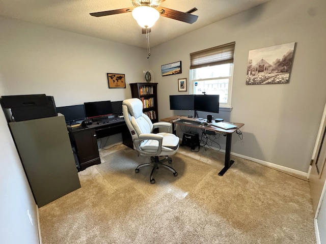 office with ceiling fan, a textured ceiling, baseboards, and carpet flooring