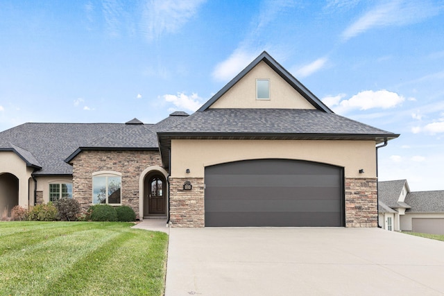 view of front of home with concrete driveway, roof with shingles, an attached garage, a front lawn, and stucco siding