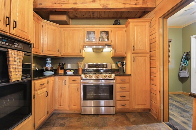 kitchen with ventilation hood, dark countertops, gas range, and dobule oven black