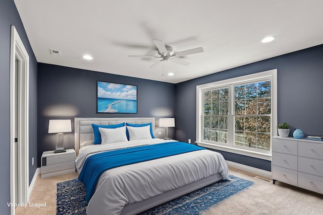 bedroom with carpet floors, recessed lighting, visible vents, and baseboards